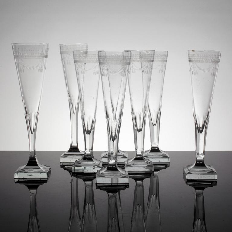A set of 8 early 19th century champagne glasses.