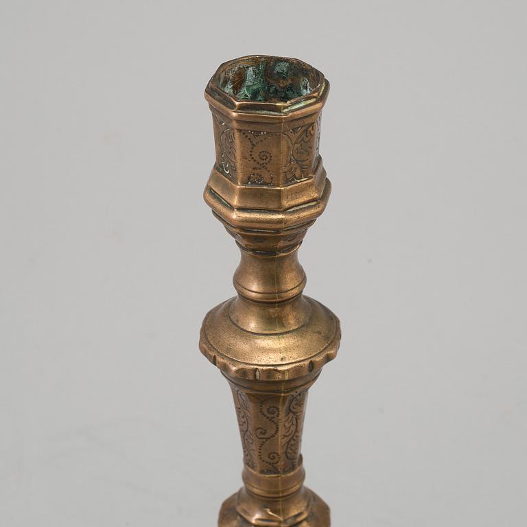 A 18th century bronze candlestick.