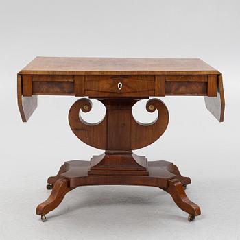 A Swedish Empire mahogany center table, early 19th century.