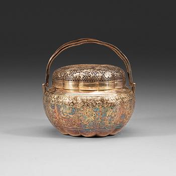115. A silverplated copper hand warmer, Qing dynasty (1644-1912).