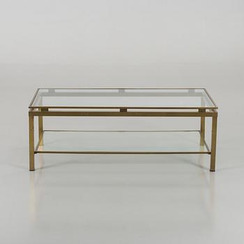 A BRASS GLASS TOP COFFEE TABLE.