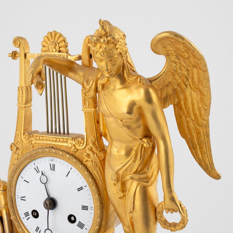 A French Empire ormolu figural mantel clock, early 19th century.