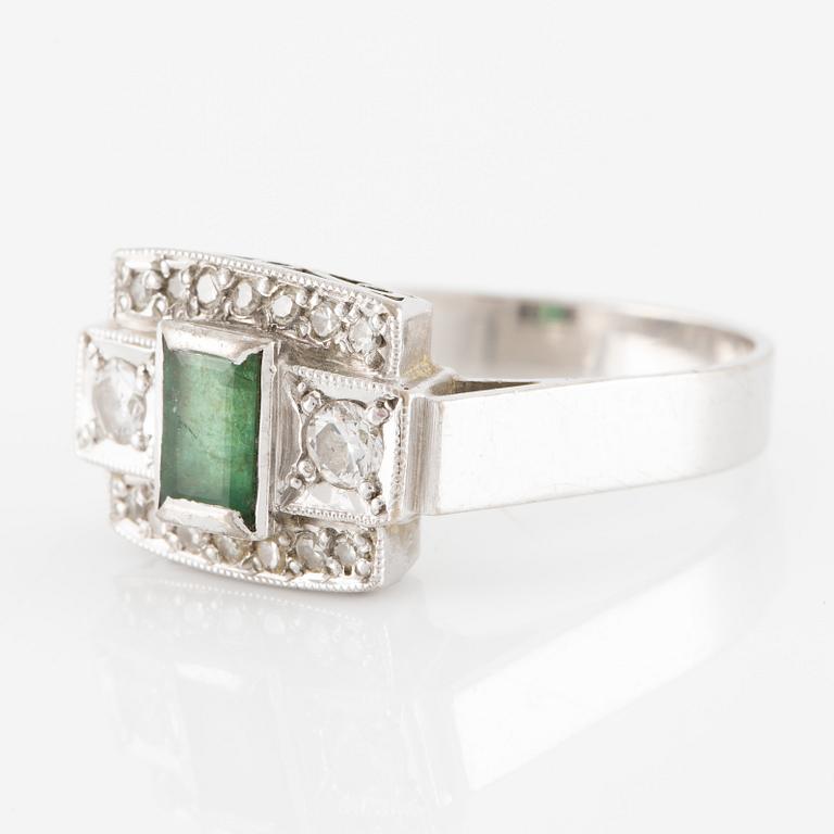 Ring in 18K white gold set with a step-cut emerald and round brilliant-cut and eight-cut diamonds.