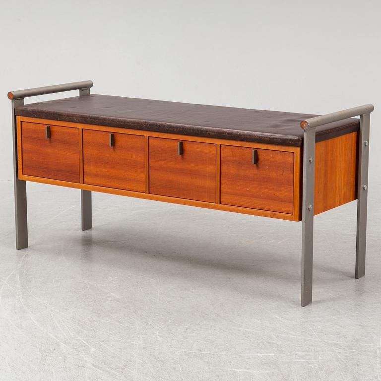 A contemporary leather and metal bench.