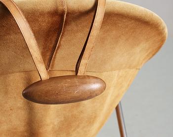 An Erik Ole Jörgensen leather and chromed steel lounge chair.