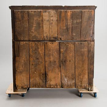 A QUEEN ANNE COURT CUPBOARD, oak, England dated 1697.