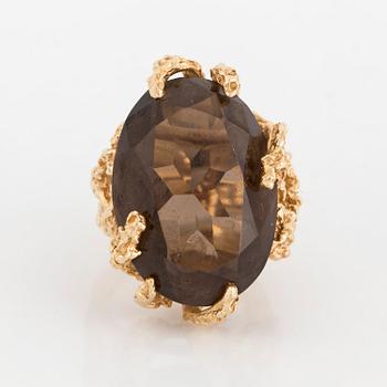 A smoky quartz cocktail ring.