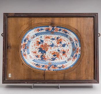 An imari dish, Qing dynasty, Qianlong (1736-95). Set in a frame.