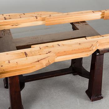 A late 19th century dining table with ten chairs and five extension leaves.