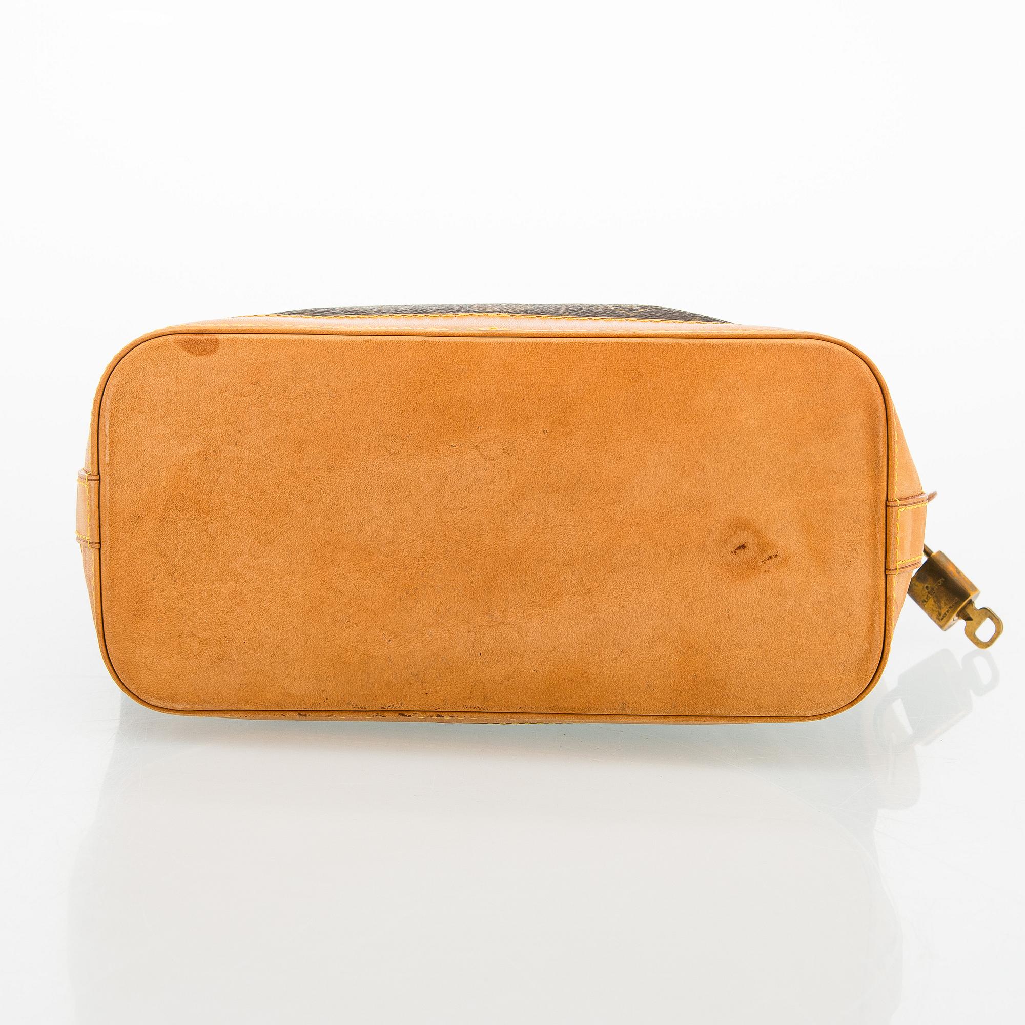 Louis Vuitton, a 'Lockit PM' bag.