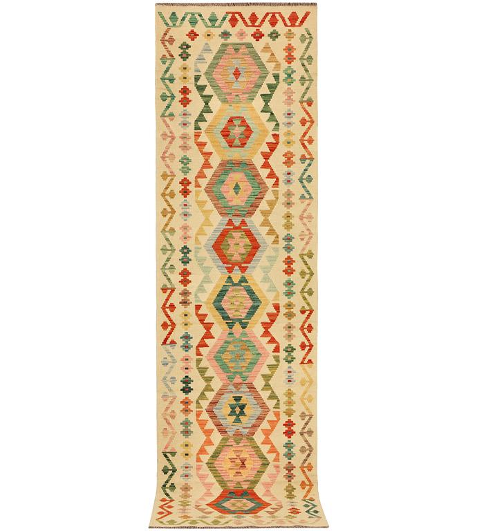 A Kilim runner carpet, c. 291 x 77 cm.