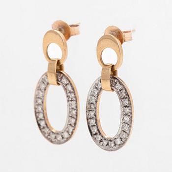 A pair of 14K gold earrings, with diamonds totalling approx. Finnish hallmarks.