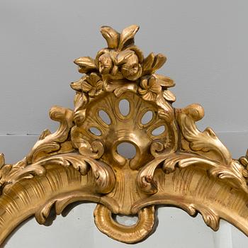 A late 19th century mirror in rococo style.