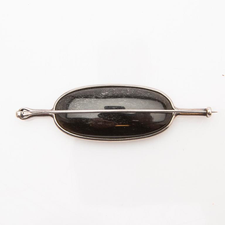 Vivianna Torun Bülow-Hübe, brooch, silver with mother-of-pearl and obsidian.