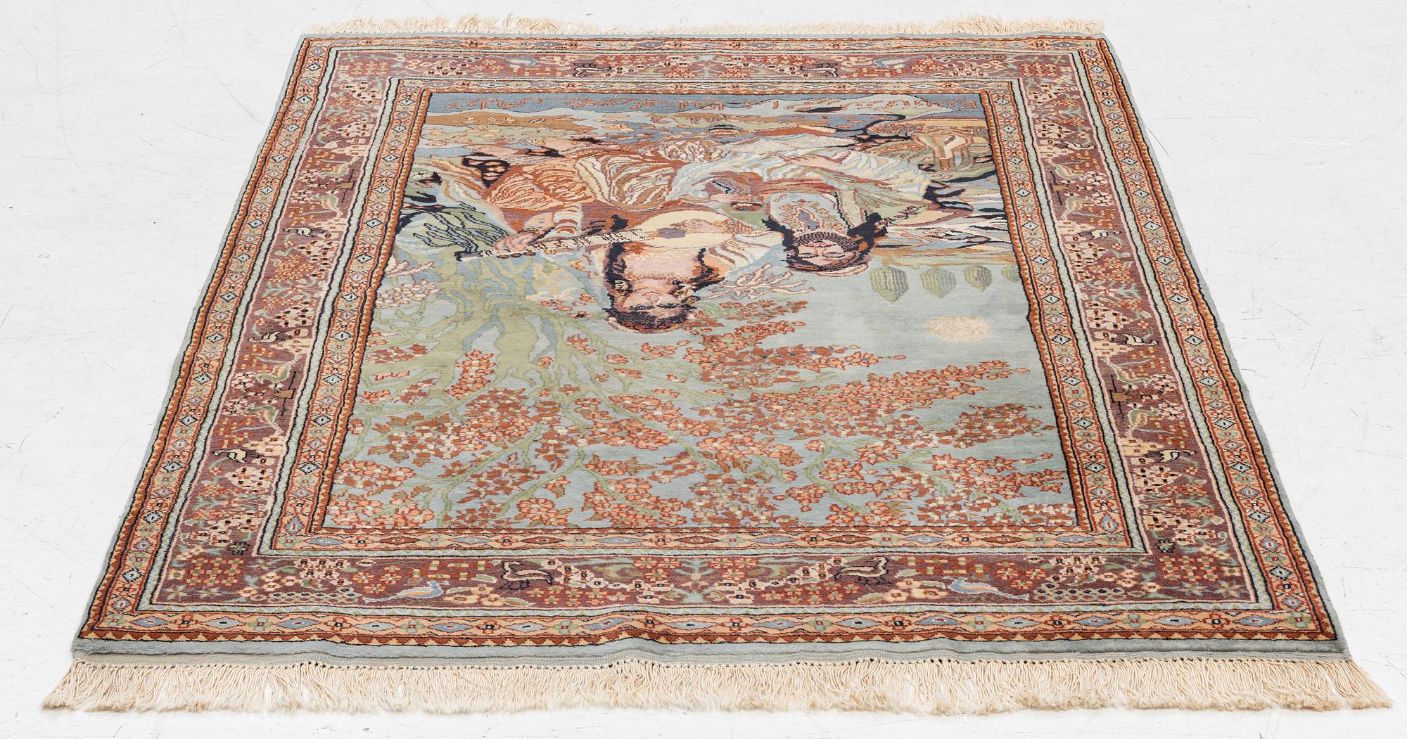 An oriental figural rug, c. 182 x 128 cm.
