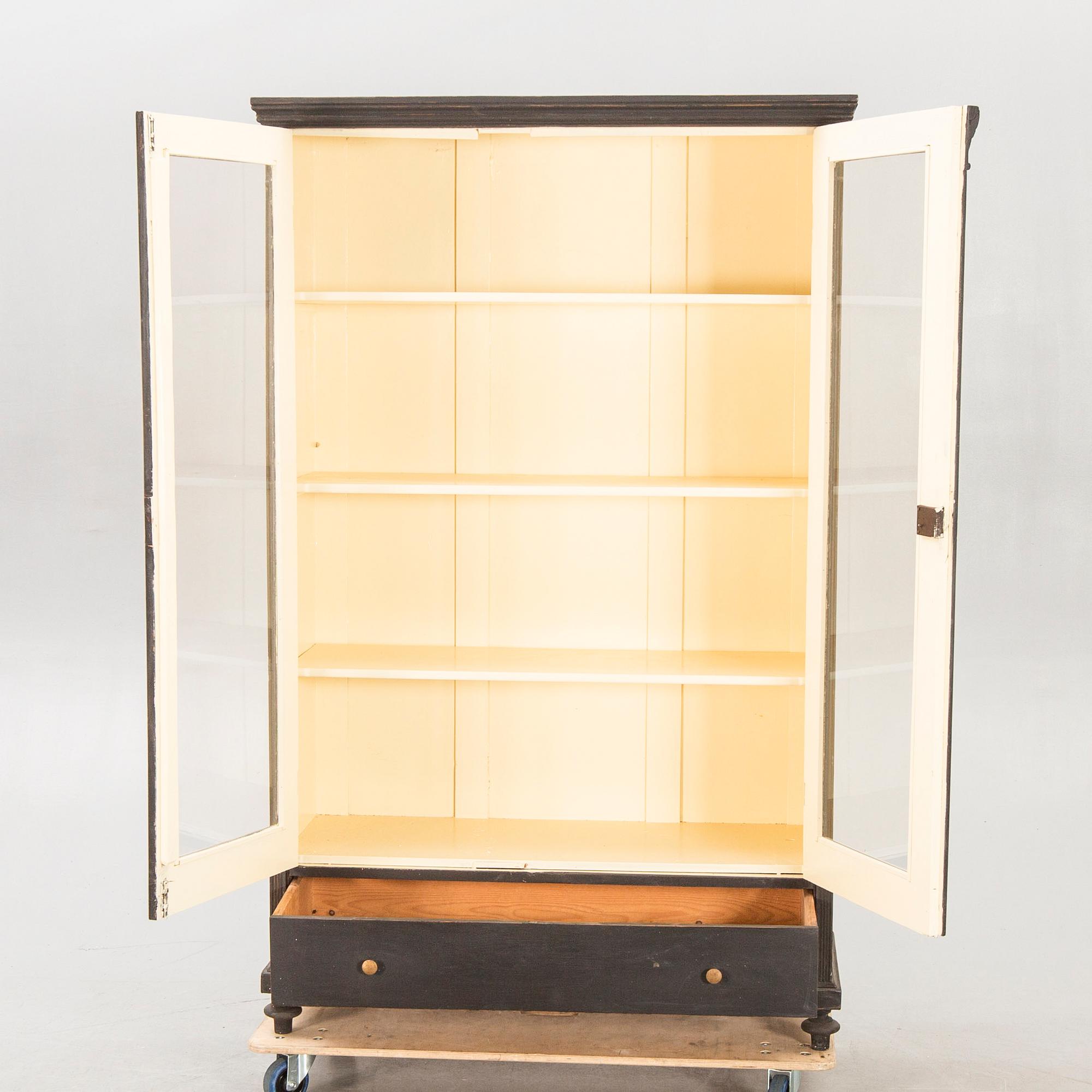 A painted early 1900s display cabinet.