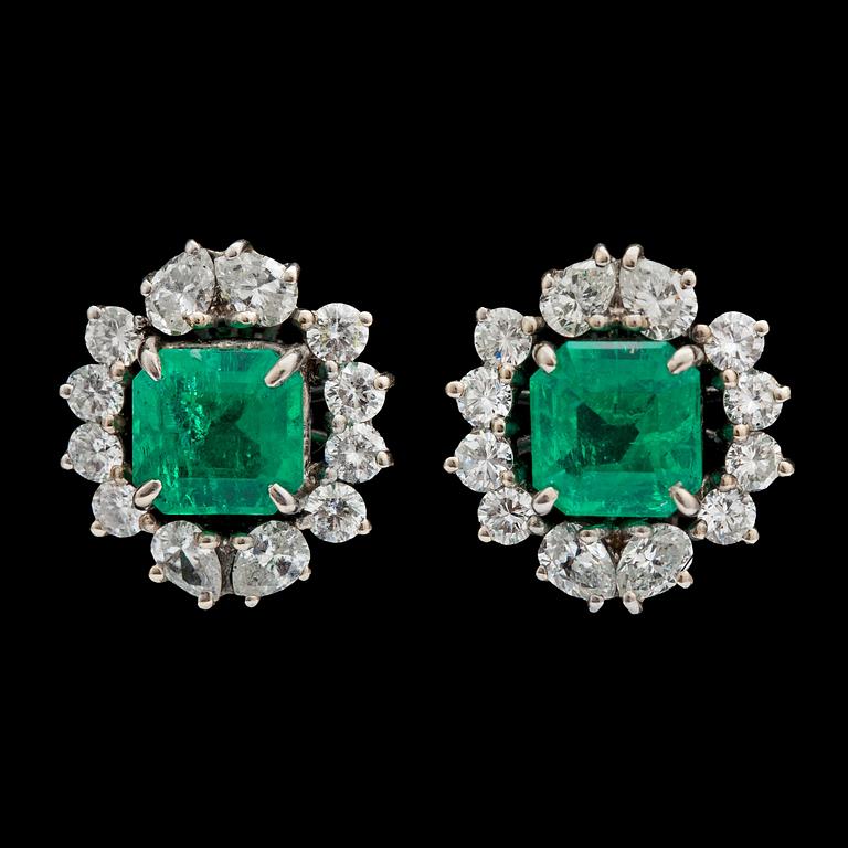 A pair of step cut emerald, tot. app. 2.70 cts, and diamond earrings, tot. app. 1.90 ct.
