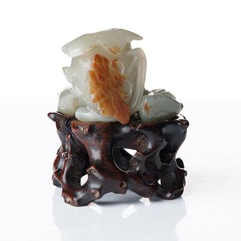 A sculptured nephrite belt buckle, figurine and brush washer, late Qing dynasty.