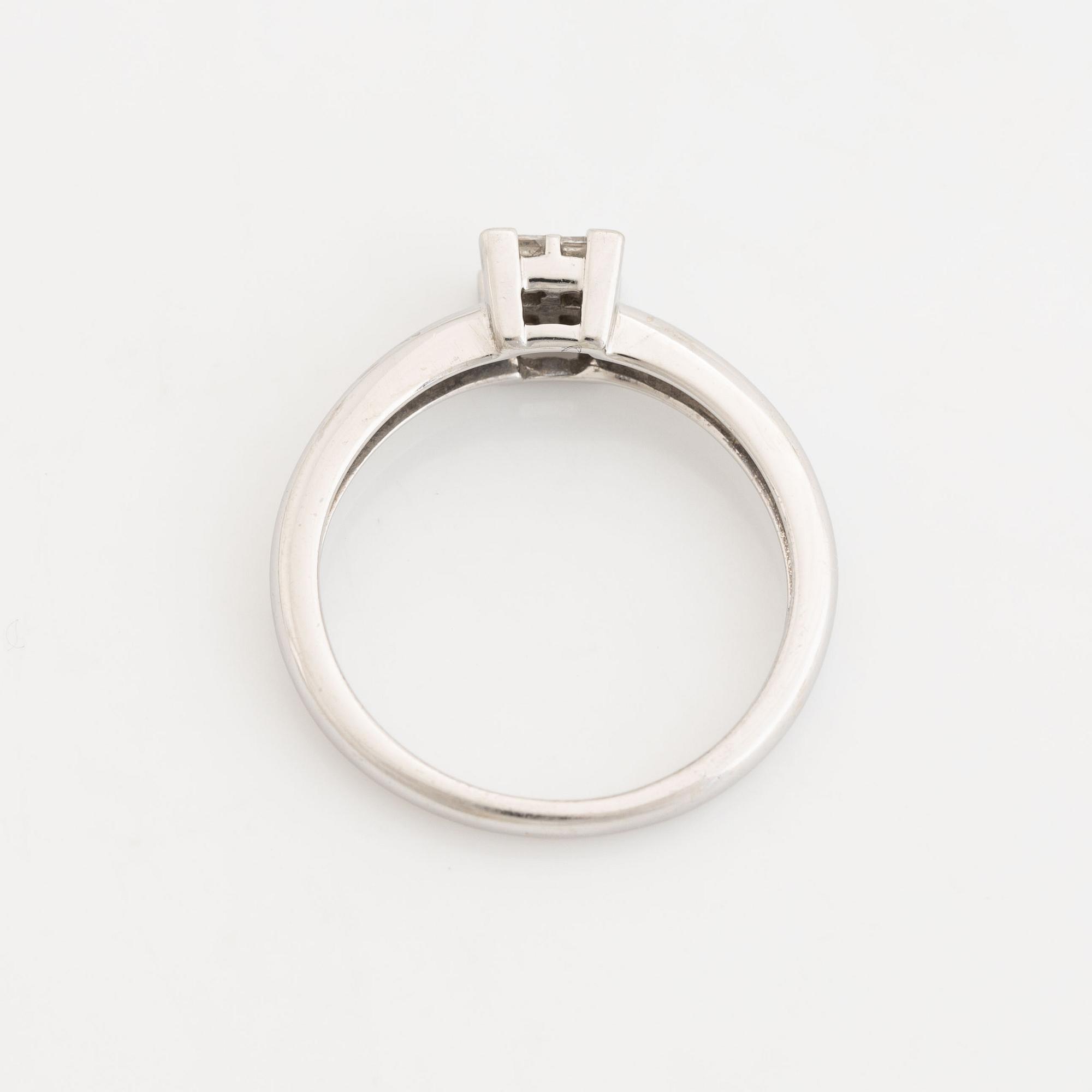 Four princess cut diamond ring.