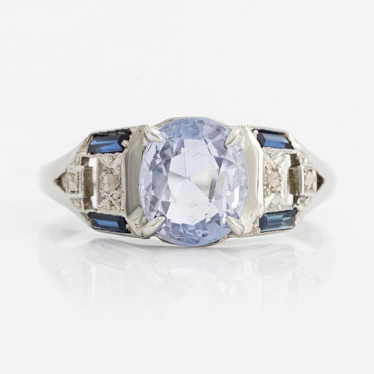 Ring with light blue sapphire.
