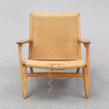 A 'CH-25' armchair designed by Hans J Wegner for Carl Hansen & Søn, Denmark.