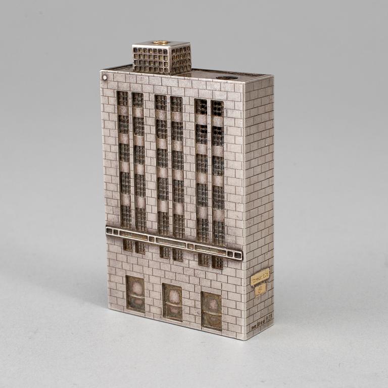A Tiffany & Co. silver cigarette-lighter, marked London 1970.
