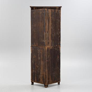 A gustavian style painted corner cabinet, 19th century.