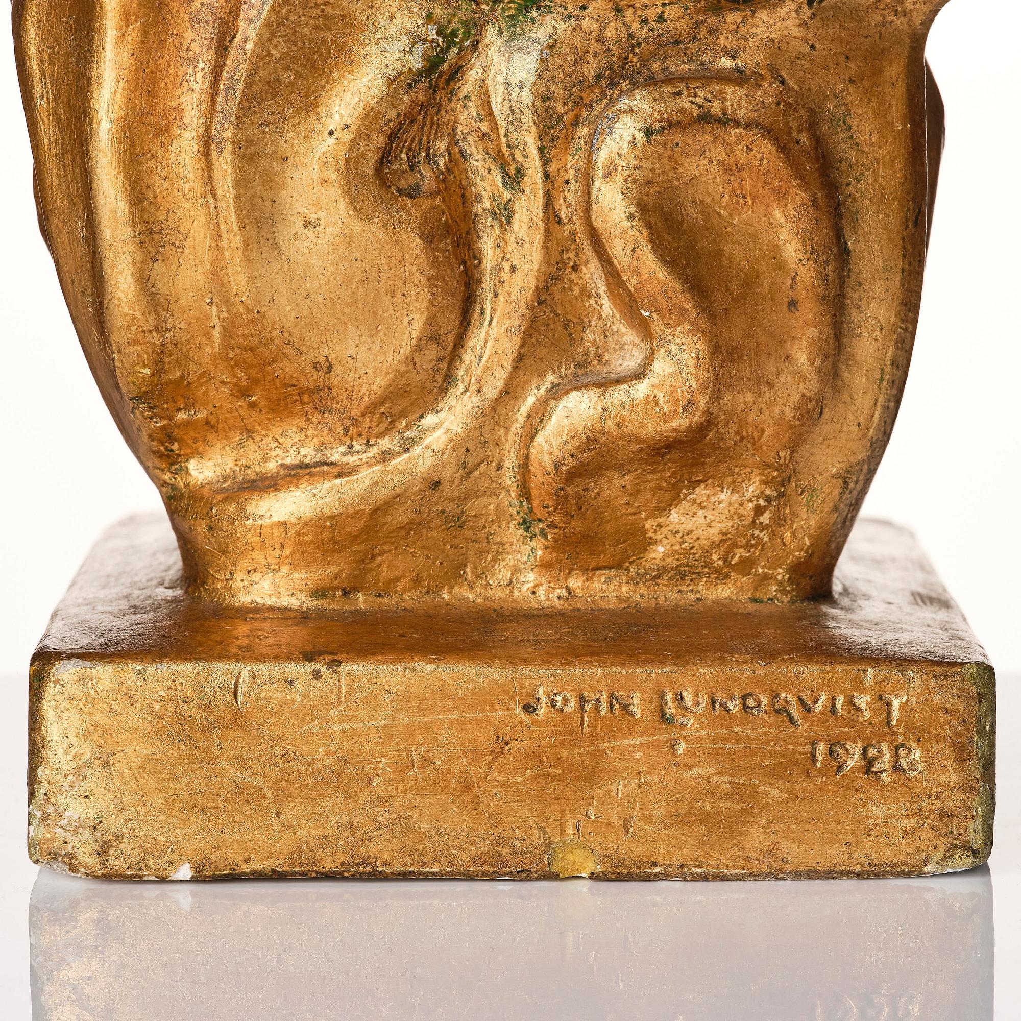 John Lundqvist, a gilded plaster sculpture of a lyre player, dated 1928.