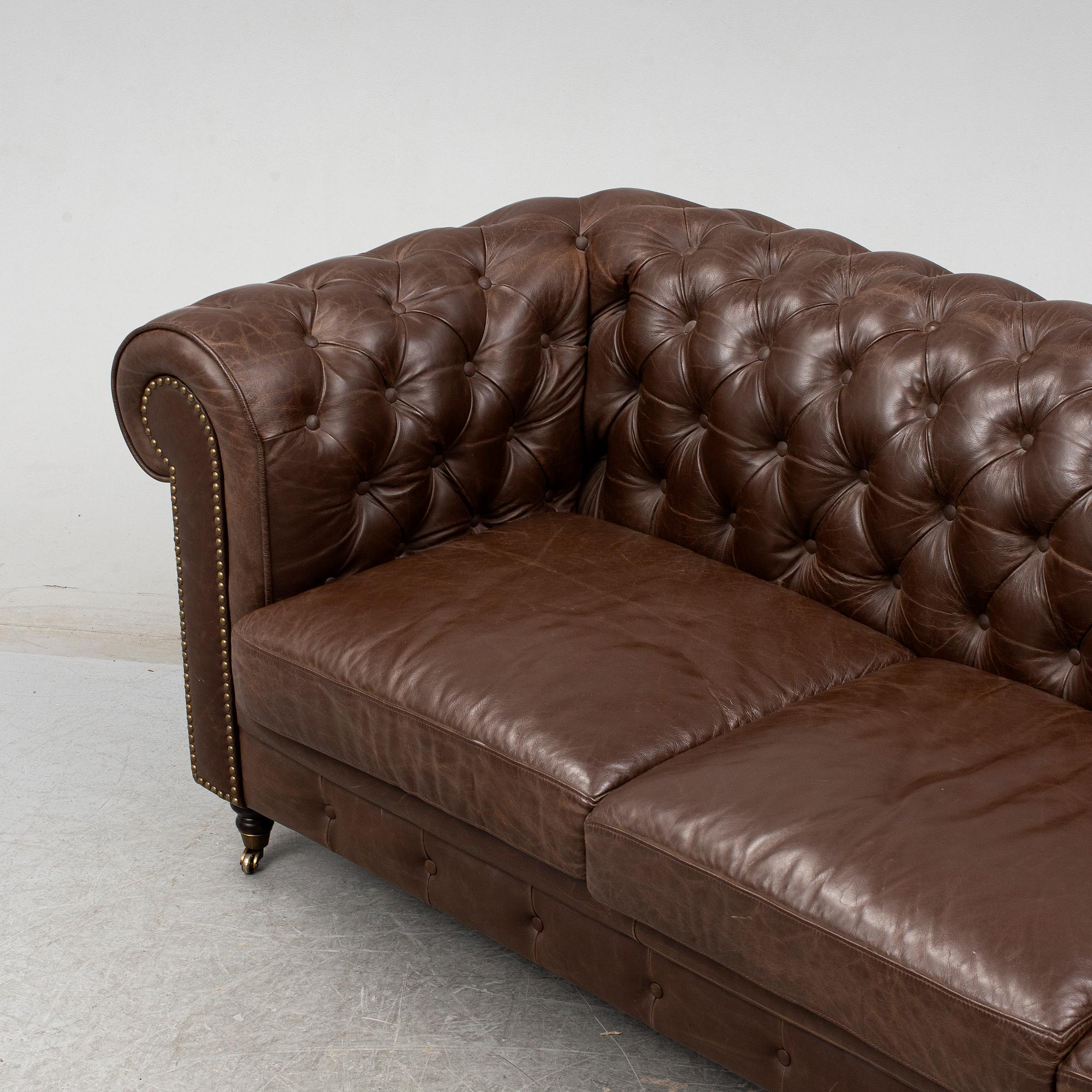 A modern chesterfield sofa.