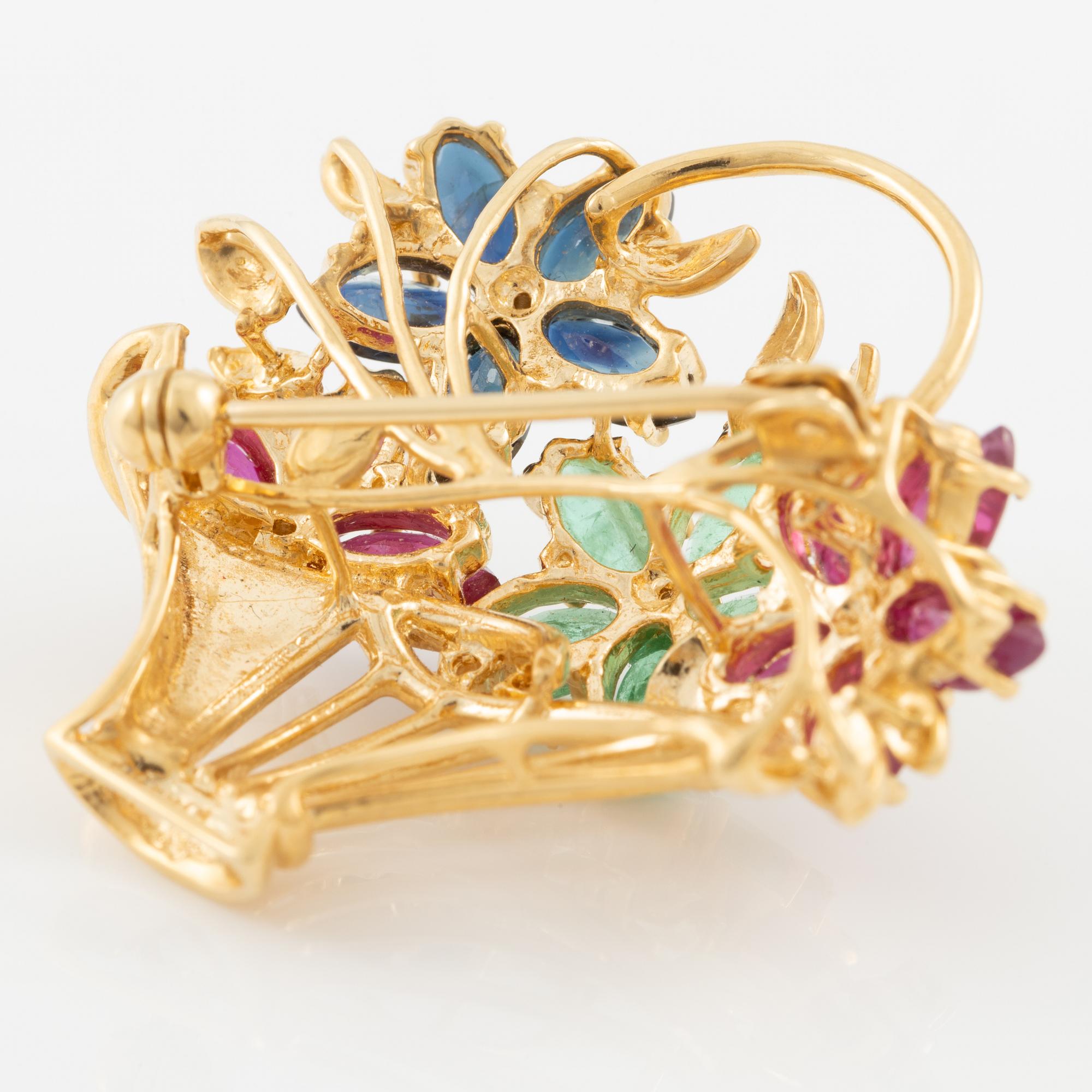 Brooch 18K gold set with round brilliant-cut diamonds as well as emeralds, sapphires, and rubies.