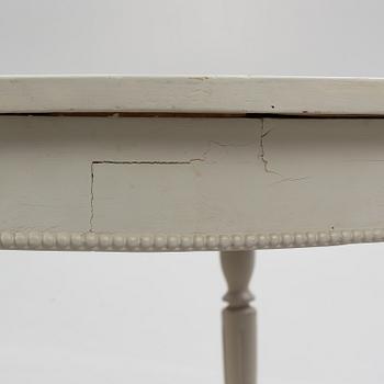 A late 19th Century painted dining table.