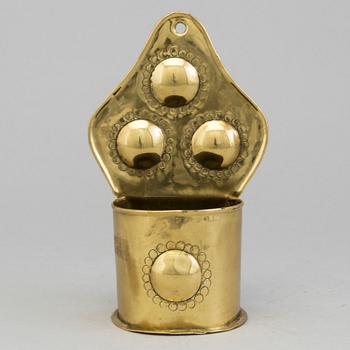 A 19th century brass spoon holder.