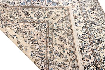 A Nain, part silk carpet, c. 337 x 244 cm.