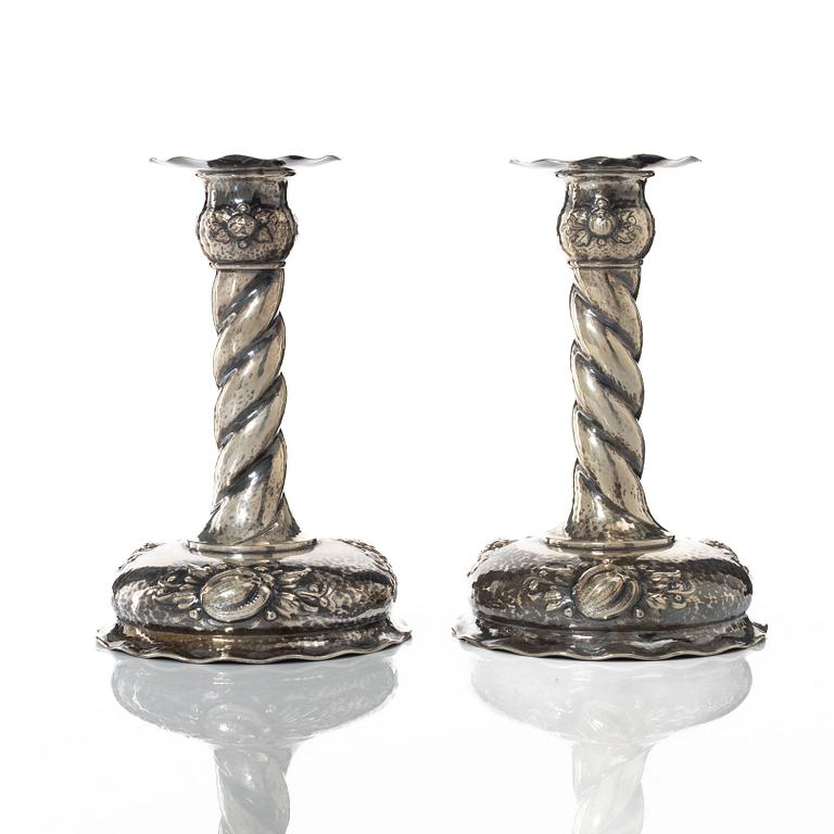 A pair of Baroque style silver candlesticks, marks of CG Hallberg, Stockholm 1942.
