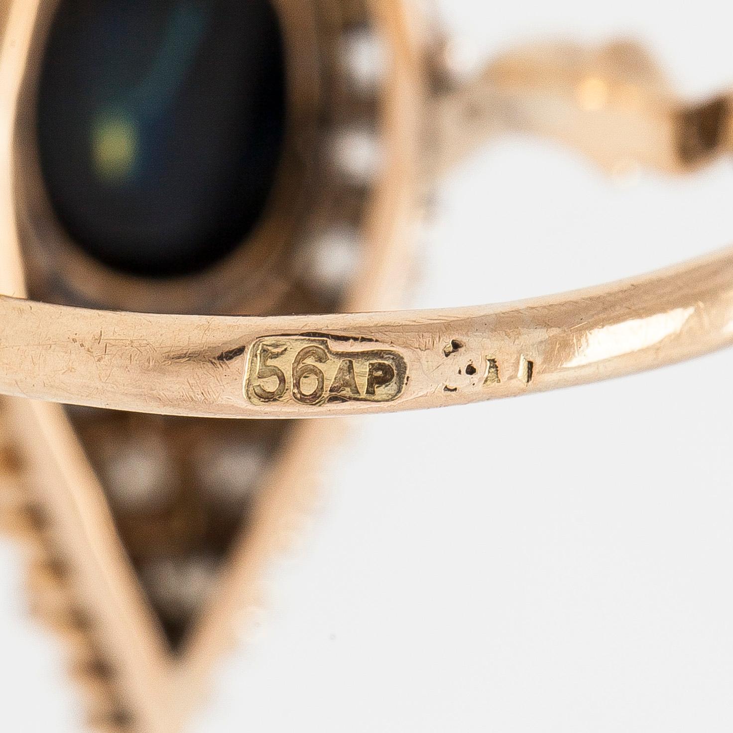 Ring in 14K gold, old-cut diamonds and a sapphire, cyrillic assay mark AP, Russia, around year 1900.