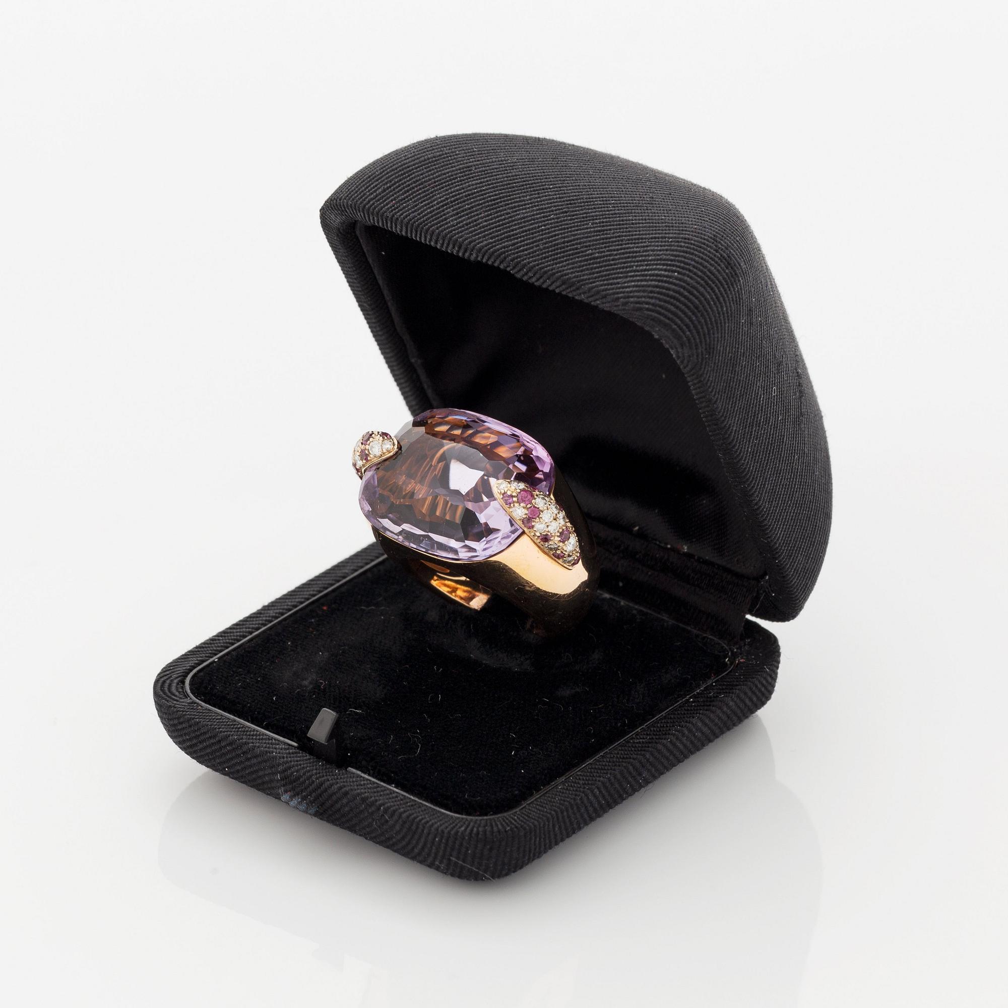 A Pomellato ring set with amethysts and round brilliant-cut diamonds.