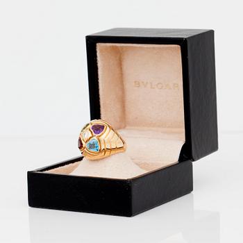 A Bulgari blue topaz, citrine, peridot, amethyst and circa 0.10 ct diamond ring.