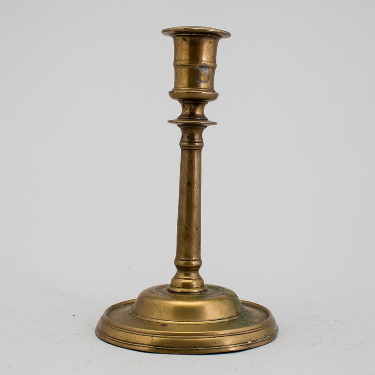 A 1500s bronze candlestick.