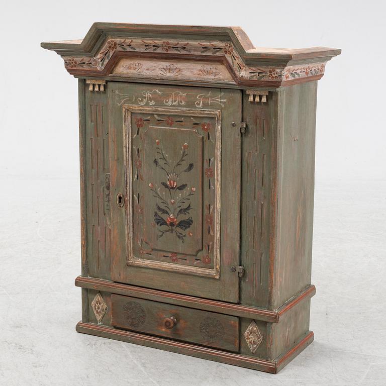 A painted 19th Century wall cabinet.