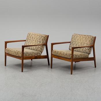 A pair of 'USA 75' teak easy chairs by Folke Ohlsson for Dux.