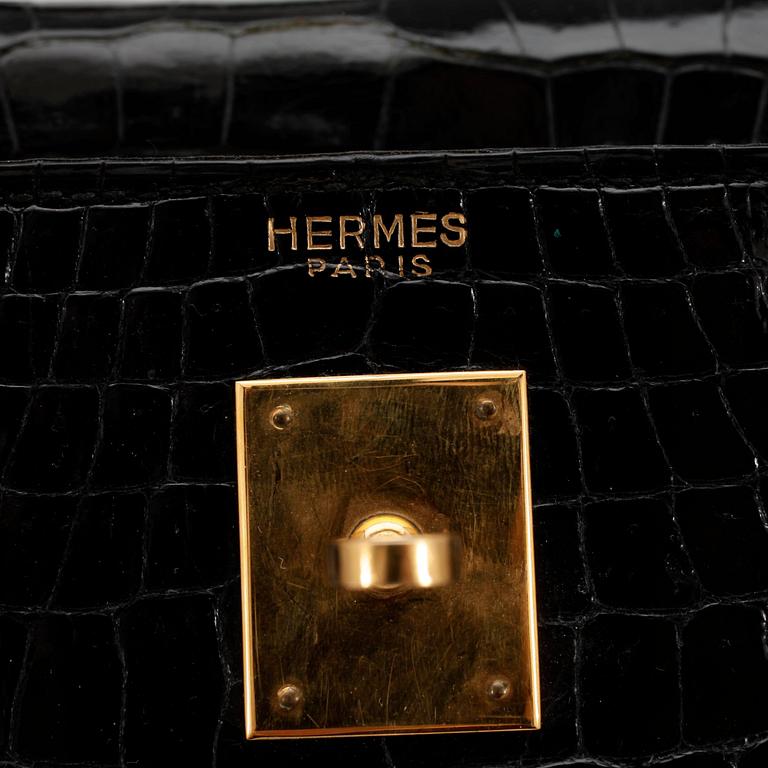 HERMÈS, a black crocodile "Kelly 35" bag from the 1960s.