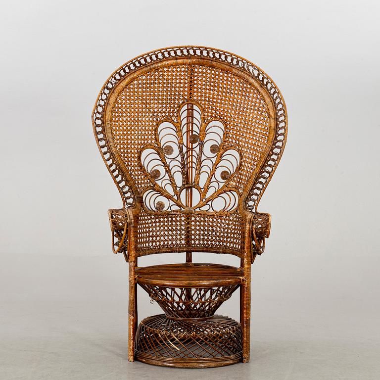 A RATTAN ARMCHAIR.