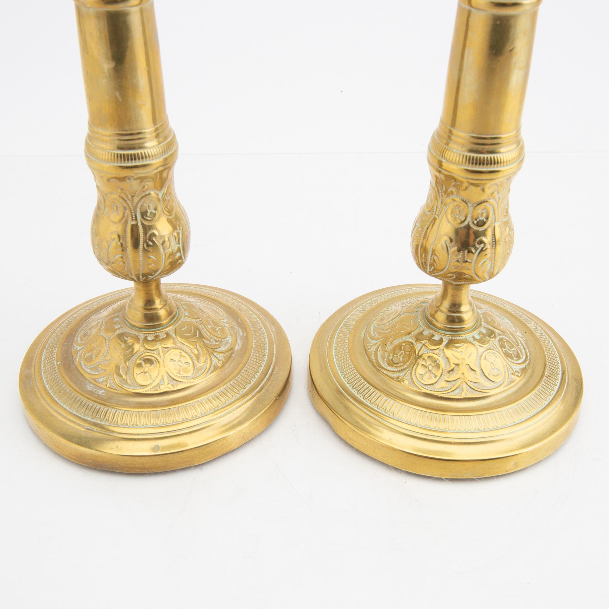 A pair of 19th century brass candle sticks.