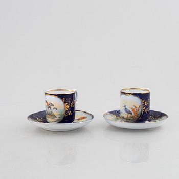 A set of nine porcelain coffee cups with saucers, Kuznetsov, Russia (1891-1917).