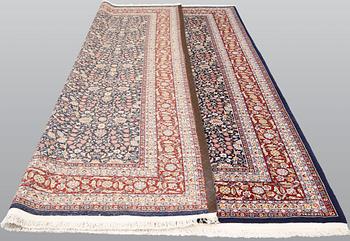 A signed Hereke carpet, ca 340 x 246 cm.