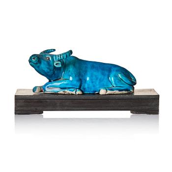 958. A turquoise glazed figure of a reclining water buffalo, Qing dynasty, 19th century.