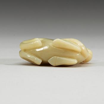 A nephrite figure of a reclining horse with a monkey, China.
