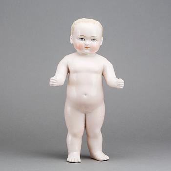 A PORCELAIN "FROZEN CHARLIE" DOLL, from around 1900.