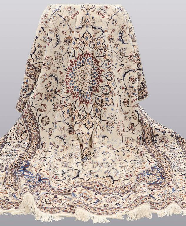 A carpet, Nain part silk, 361 x 262 cm.