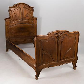 A pair of early 20th Century art nouveau style beds.